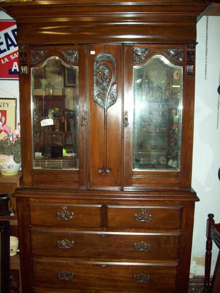 Appraisal: AN EDWARDIAN FIVE DRAWER TALL BOY WITH TWO MIRROR DOORS