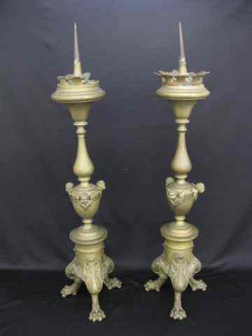 Appraisal: Pair of th Century Brass Candle Stands cherub trim heavy