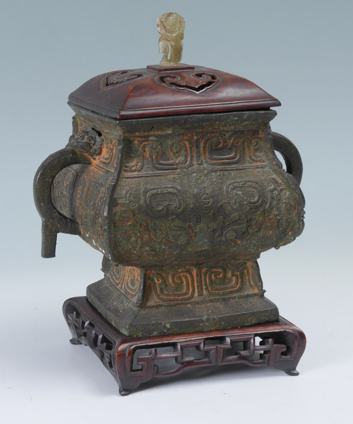 Appraisal: CHINESE ARCHAIC STYLE BRONZE COVERED VESSEL Cast bronze vessel with