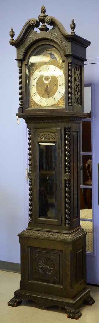 Appraisal: Carved oak bell and chime striking tall case clock day