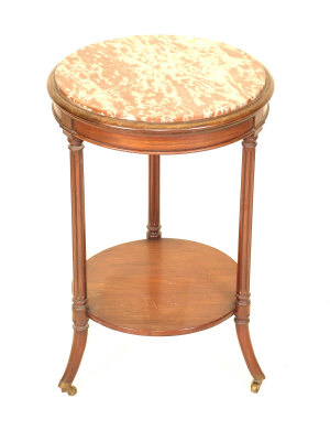 Appraisal: A mahogany two tier circular table early th century the