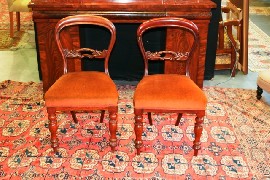 Appraisal: A set of four Australian cedar and upholstered baloon back