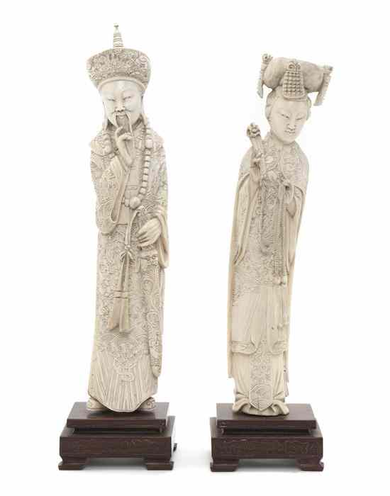 Appraisal: A Pair of Chinese Carved Ivory Figures depicting an emperor