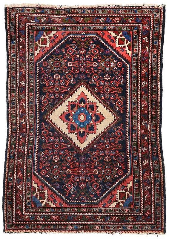 Appraisal: Persian Rug central diamond shaped medallion navy blue field salmon