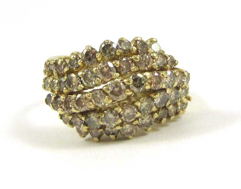 Appraisal: CHAMPAGNE DIAMOND AND FOURTEEN KARAT GOLD RING set with a