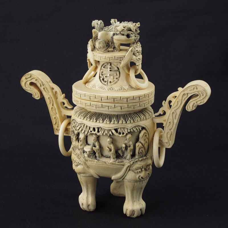 Appraisal: CARVED IVORY CENSOR Foo dog finial with rings on lid