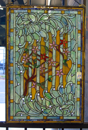 Appraisal: A STAINED AND LEADED GLASS WINDOW PANEL The predominantly pink