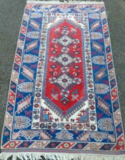 Appraisal: Persian type blue ground rug the centre with three medallions