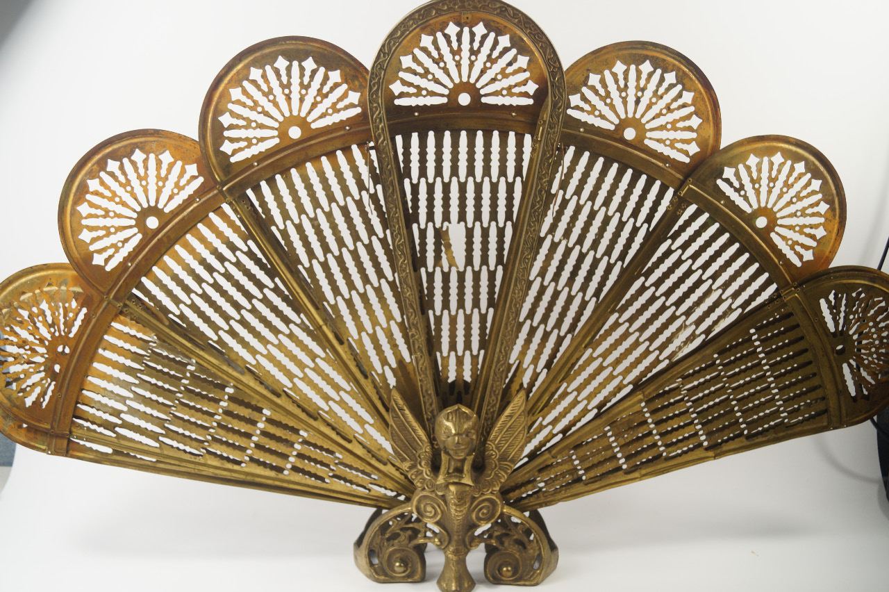 Appraisal: A brass phoenix fan shaped fire screen cm high