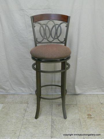 Appraisal: Ornamental Metal Teak Swivel Bar Stool - Metal art design