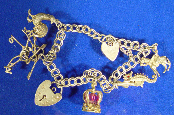 Appraisal: Silver charm bracelet with assorted silver charms