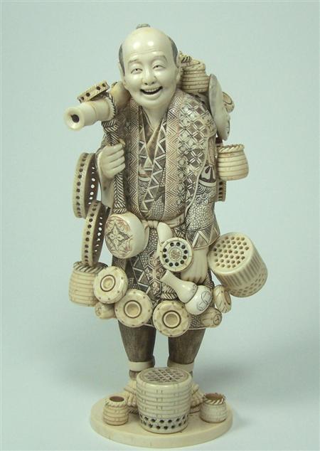 Appraisal: A large Japanese ivory figure of a basket seller Meiji