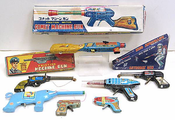 Appraisal: Toy guns Ensemble of lithographed machine guns several boxed space