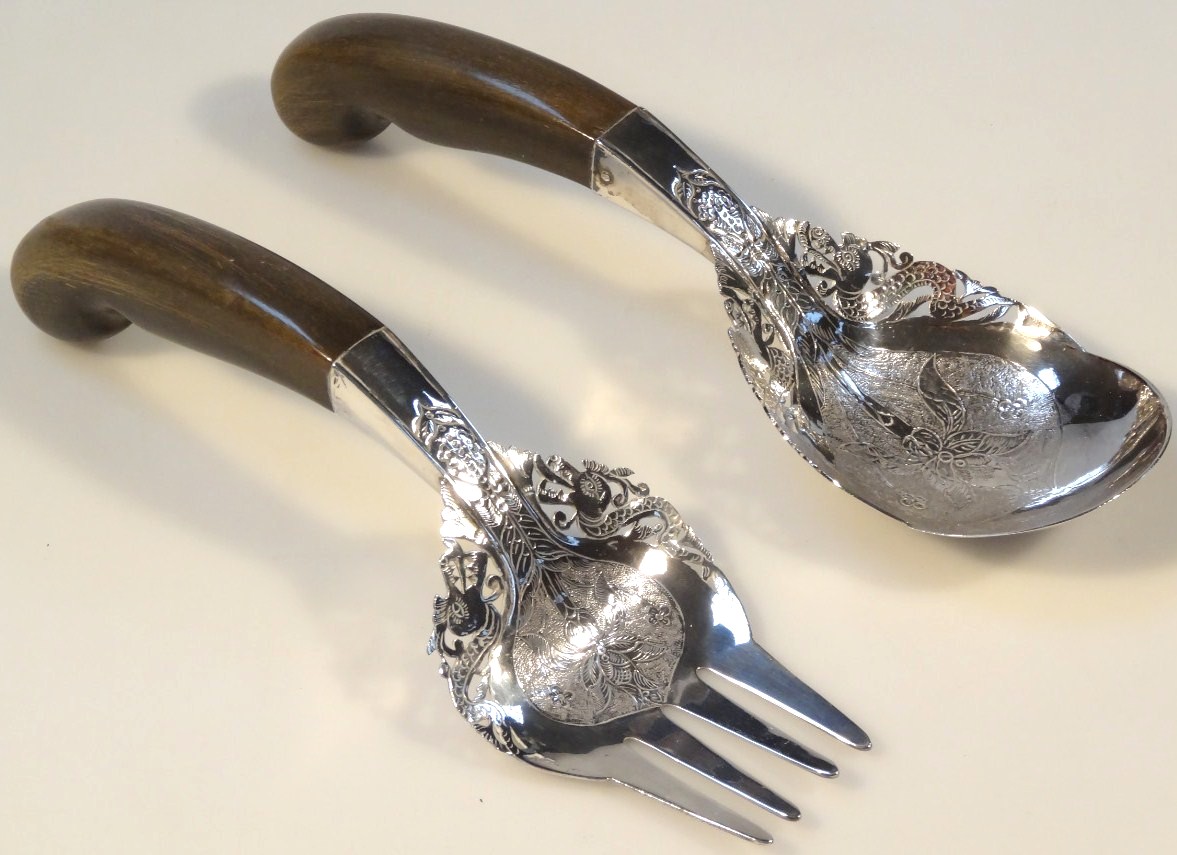 Appraisal: A pair of salad servers each with heavily etched and