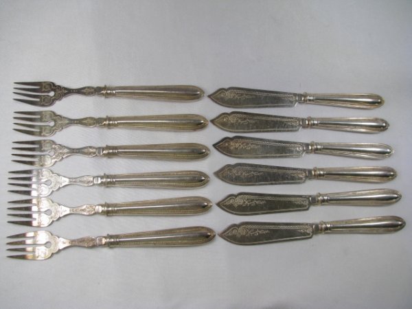 Appraisal: Silver plated forks and knives have a brite cut swirl