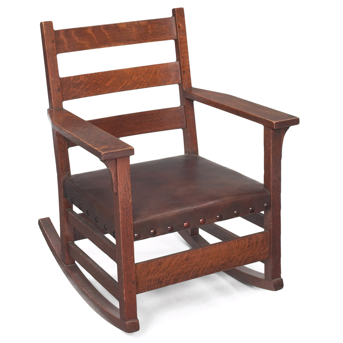 Appraisal: Gustav Stickley rocker threehorizontal slats at back over a replacedleather