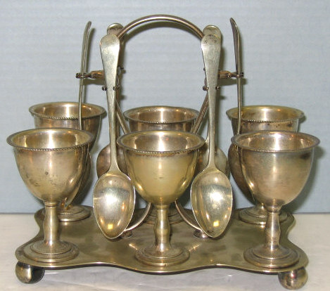 Appraisal: PLATED SILVER SIX-CUP EGG STAND Rectangular shaped base with six