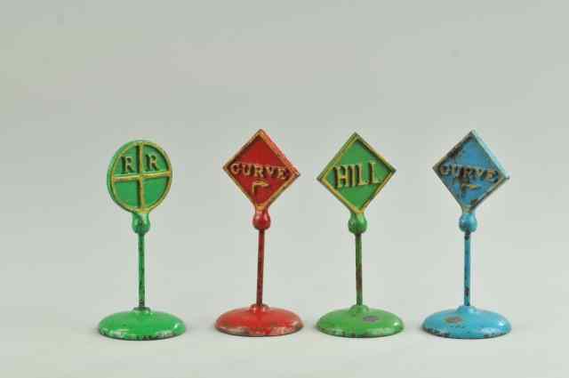 Appraisal: LOT OF FOUR ROAD SIGNS Arcade cast iron various colors