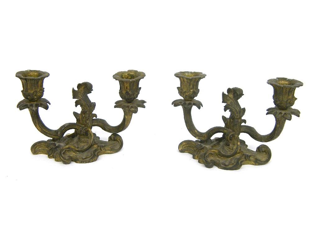 Appraisal: Pair of brass rococo twin light candelabra upon twisted arms