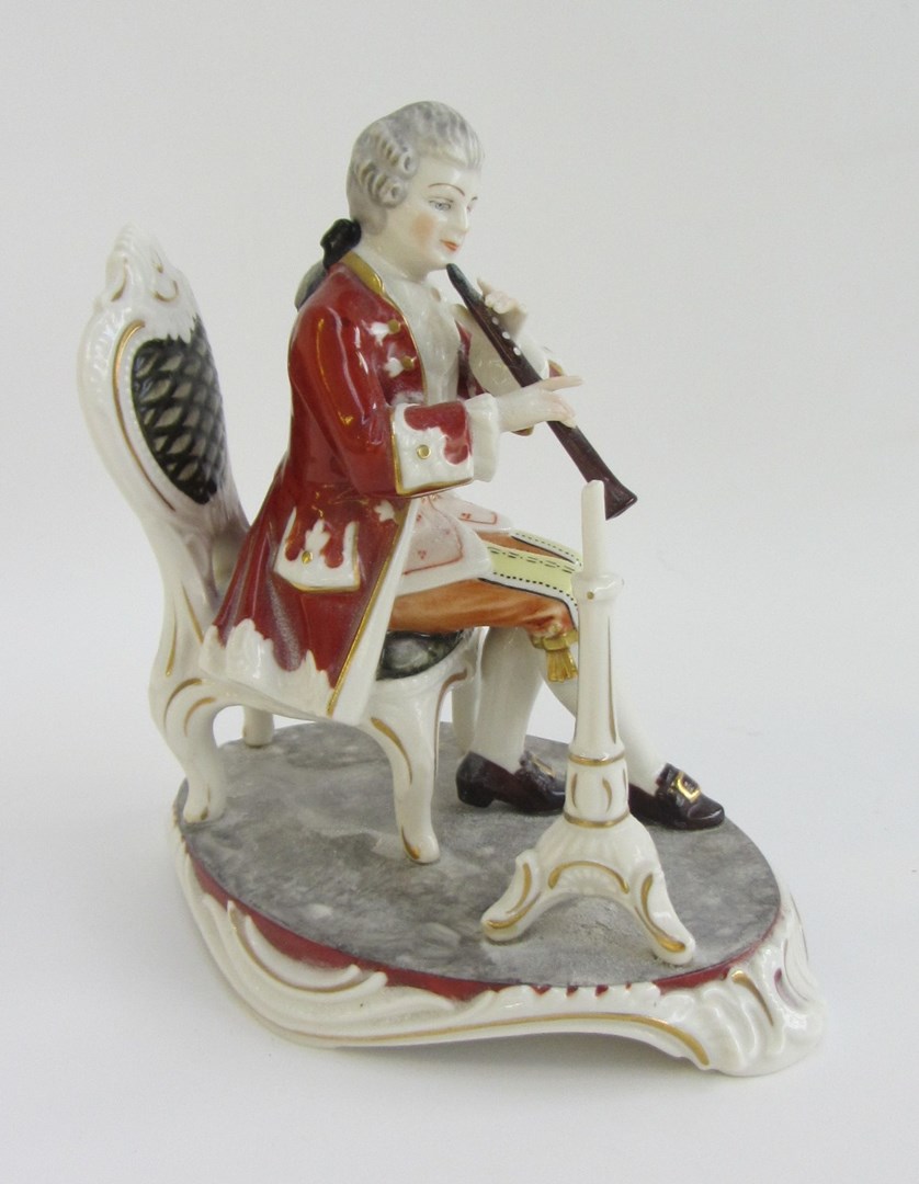 Appraisal: A Dresden porcelain figure of a seated musician with music