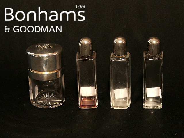 Appraisal: A silver mounted toilet bottle with hinged cover Birmingham together