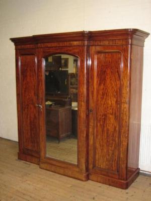 Appraisal: A VICTORIAN MAHOGANY TRIPLE WARDROBE of breakfront form the moulded