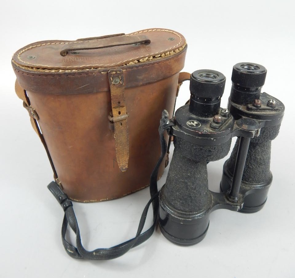 Appraisal: A pair of binoculars with ebonised decoration the leather cased