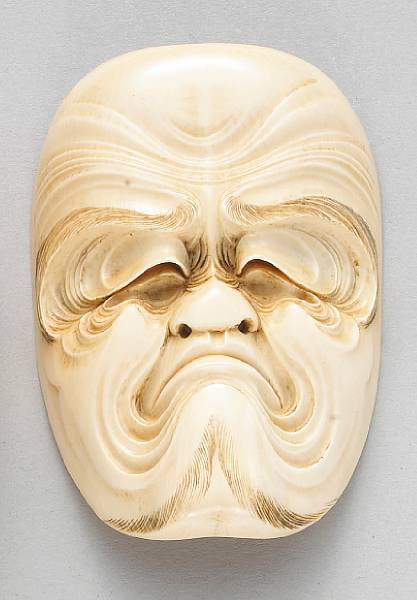 Appraisal: An ivory mask okimono Meiji Taisho Period Well carved and