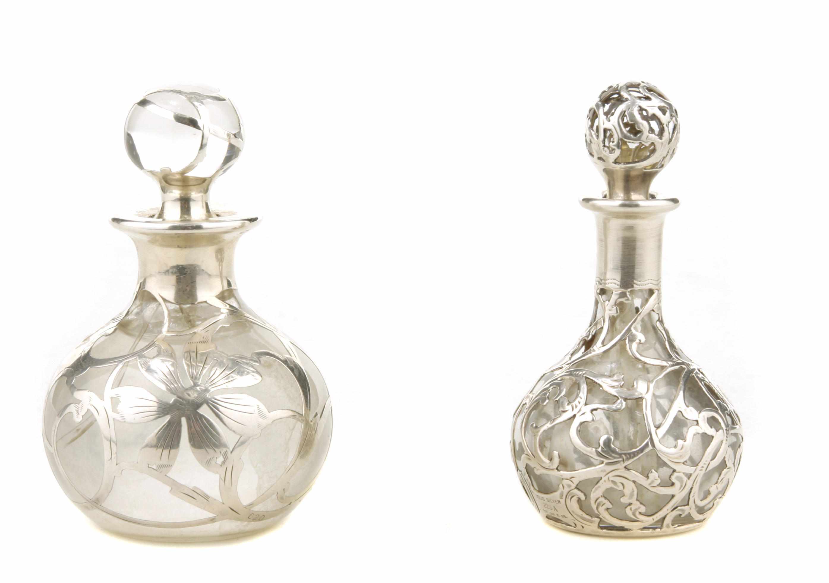 Appraisal: Two sterling silver overlaid glass perfume bottles and stoppers the