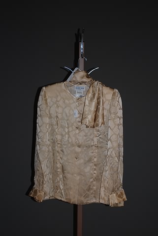 Appraisal: Andr Laug tan silk long sleeve blouse with geometric same