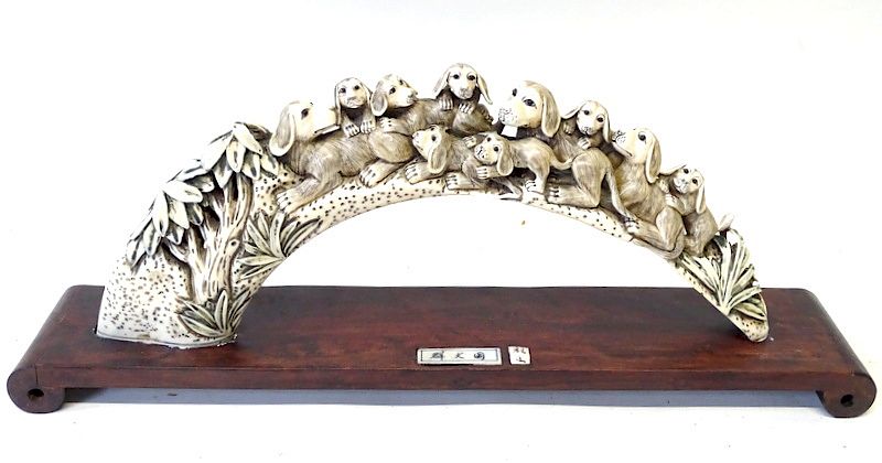 Appraisal: A Chinese Export Carved Bone Dog Theme Sculpture A Chinese