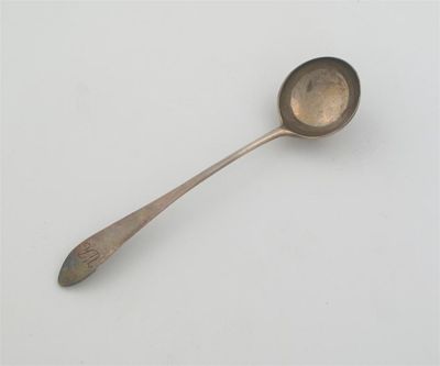 Appraisal: A George III Scottish provincial cream ladle with a pointed