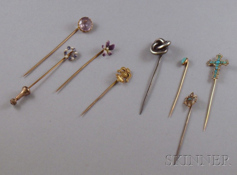 Appraisal: Eight Primarily Gold Stickpins including three turquoise examples a knight-form