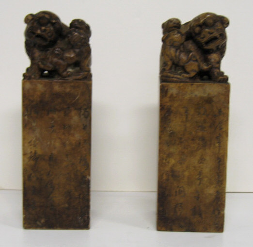 Appraisal: PAIR HARDSTONE FIGURAL SEALS Each molted brown rectangular column with