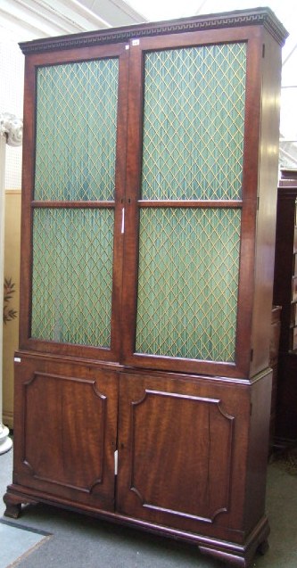 Appraisal: A th century mahogany side cabinet the dentil cornice over