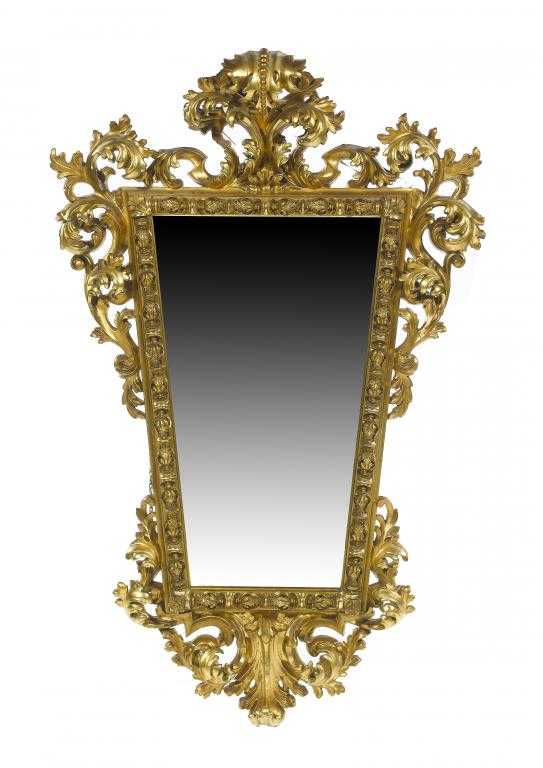 Appraisal: AN ITALIAN GILTWOOD AND COMPOSITION MIRROR of flared shape with