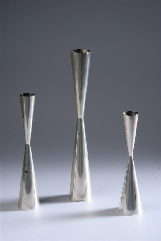 Appraisal: THREE ALLAN ADLER MODERNIST STERLING SILVER GRADUATED CANDLESTICKS mid- th