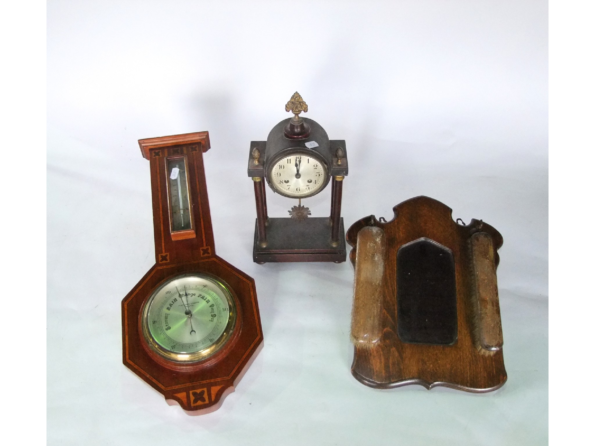 Appraisal: An inlaid Edwardian mahogany aneroid barometer a small portico clock