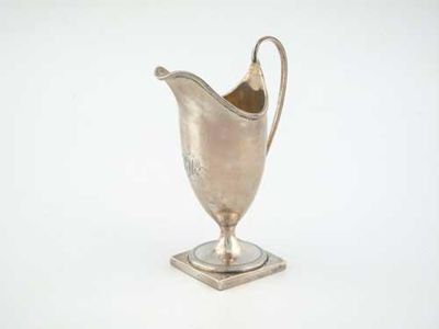 Appraisal: A George III plain helmet cream jug on a square