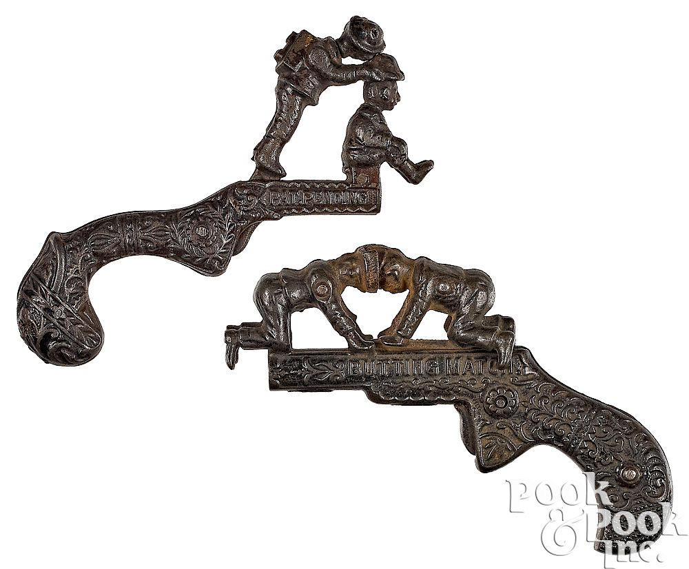 Appraisal: Two cast iron animated cap guns Two cast iron animated