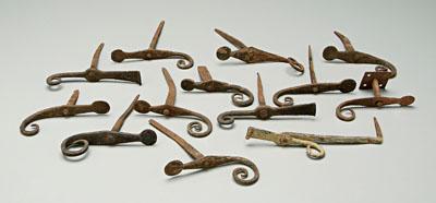 Appraisal: hand wrought iron hooks ten of similar scrolled design with