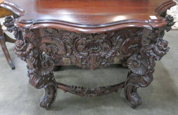 Appraisal: HIGHLY CARVED MAHOGANY CONSOLE TABLE Victorian Rococo style th century