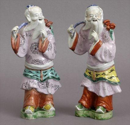 Appraisal: PAIR OF GLAZED BISCUIT FIGURES OF SAGES Identical molds of