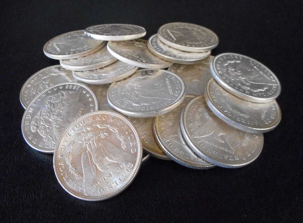 Appraisal: A ROLL OF TWENTY U S SILVER MORGAN DOLLARS all