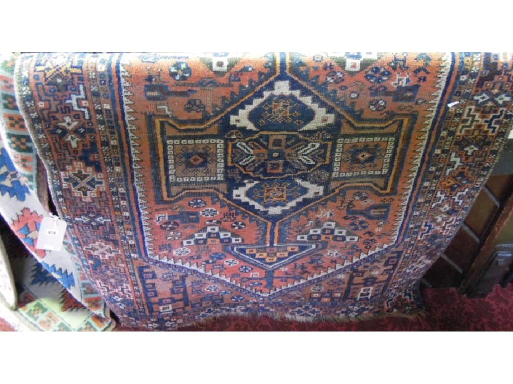 Appraisal: An old Middle Eastern rug with a central elongated lozenge