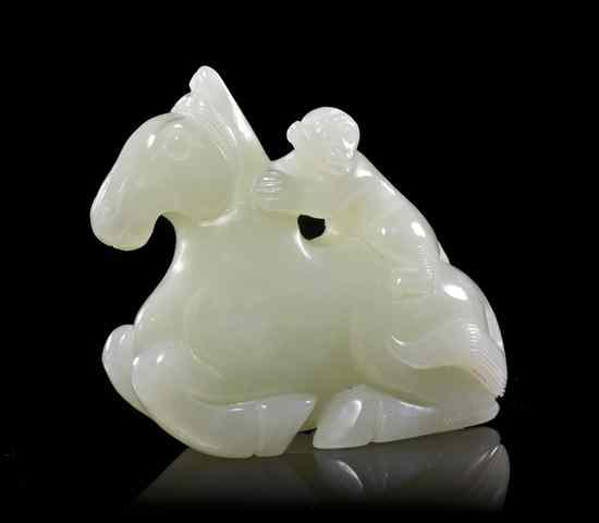 Appraisal: A Carved Jade Toggle depicted a figure on a horse