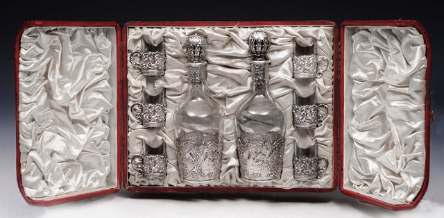 Appraisal: A CONTINENTAL GLASS AND SILVER MOUNTED LIQUEUR SET consisting of