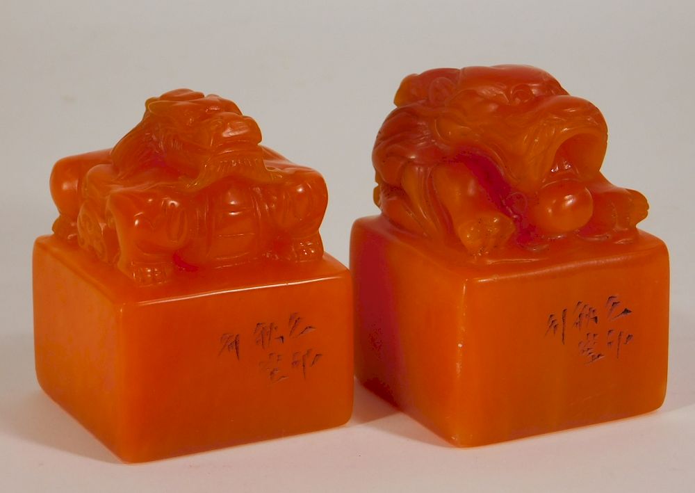 Appraisal: Chinese Carved Orange Soapstone Dragon Seals China Early th Century