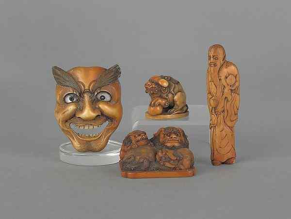 Appraisal: Four Japanese carved ivory netsuke Meiji period or earlier