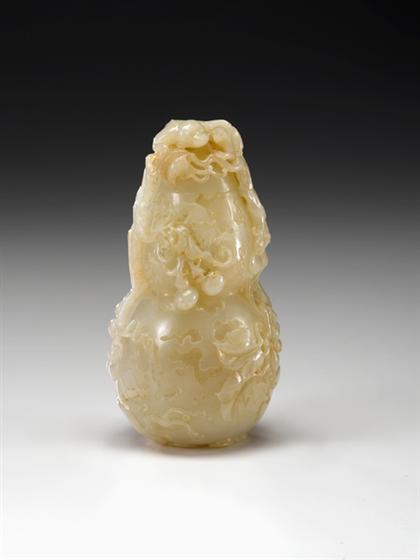 Appraisal: Very fine Chinese white jade gourd form covered vase th